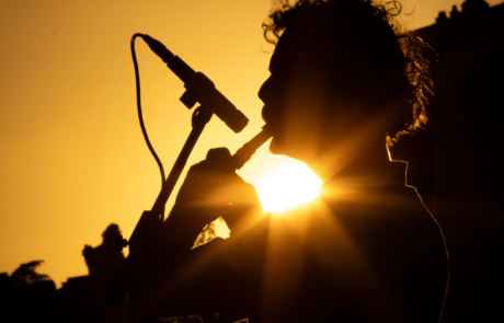 Street musician at sunset in Rome Silhouette of a musician performing at sunset in Rome